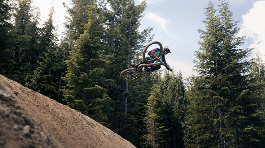 Mountain Biker Hip Jump on Dirt Merchant in Whistler