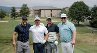 Group of Golfers Pose on the Golf Course at Liberty Mountain