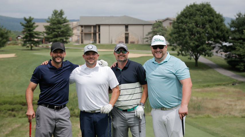 Group of Golfers Pose on the Golf Course at Liberty Mountain