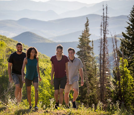 Friends hike together during a summer day at Park City