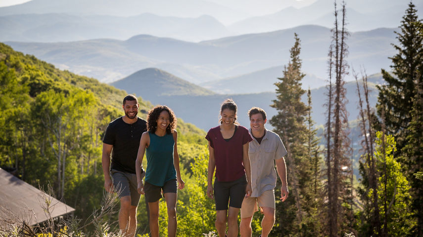 Friends hike together during a summer day at Park City