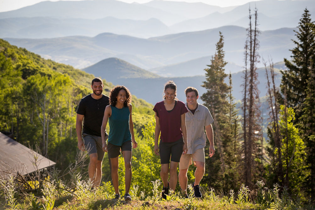 Friends hike together during a summer day at Park City