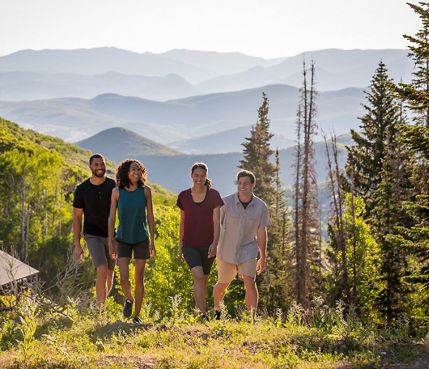 Two couples hike during a summer afternoon at Park City