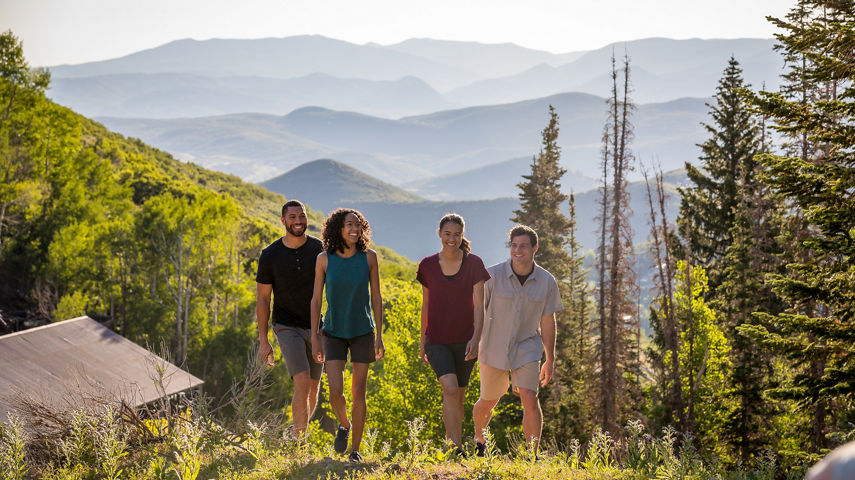 Two couples hike during a summer afternoon at Park City