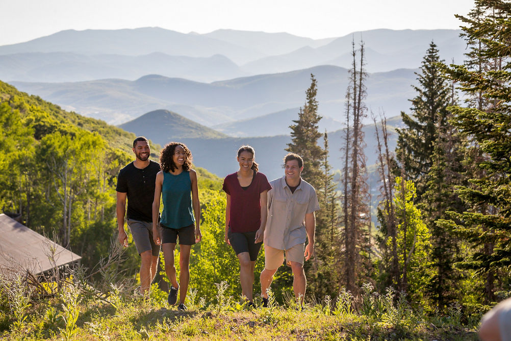 Two couples hike during a summer afternoon at Park City
