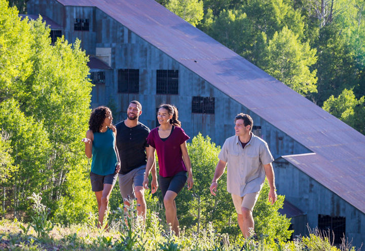 Friends walk along a trail at Park City