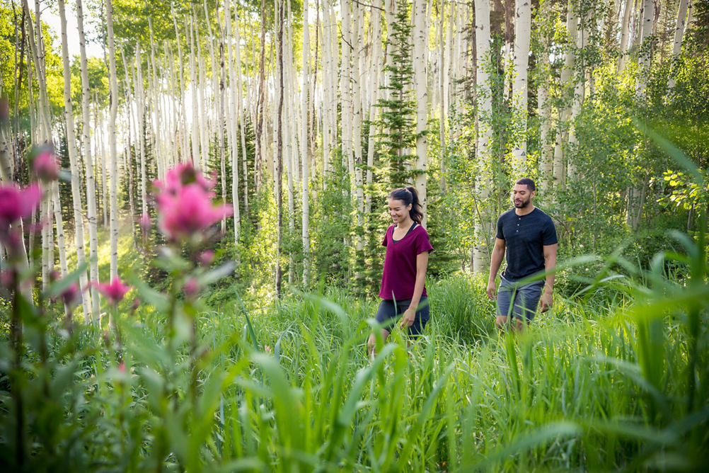 Friends hiking during a summer afternoon at Park City