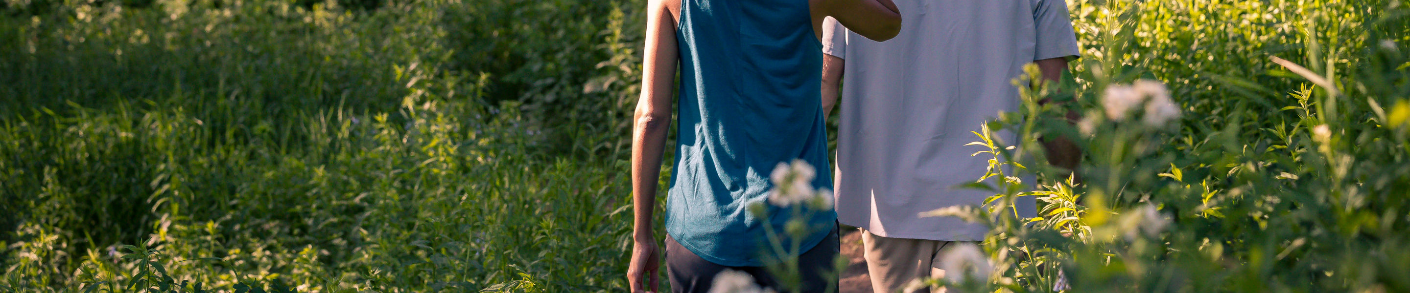 A couple walks on a summer afternoon at Park City