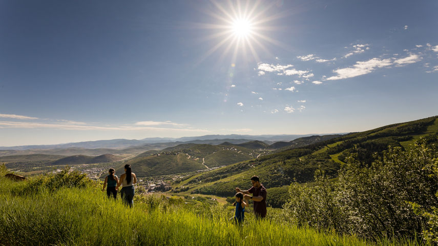 A family goes hiking during the summer at Park City