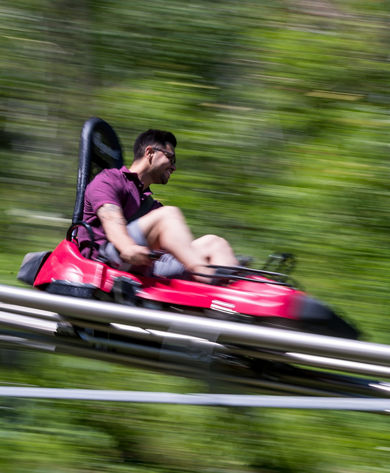 A man rides on the  Alpine Coaster during summer at Park City