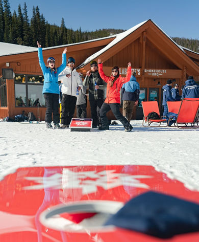 Friends play cornhole at Labontes during early season #KeystoneKickoff event in Keystone, CO.