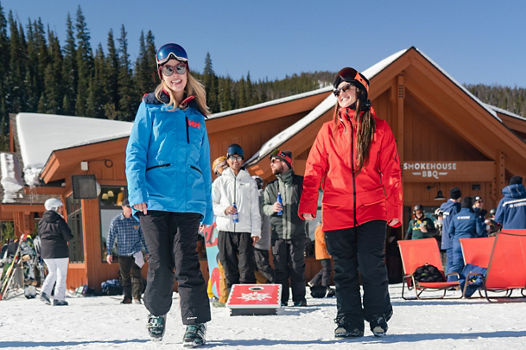 Friends play cornhole at Labontes during early season #KeystoneKickoff event in Keystone, CO.