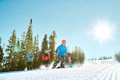 Family enjoys groomed run Schoolmarm at Keystone, CO.