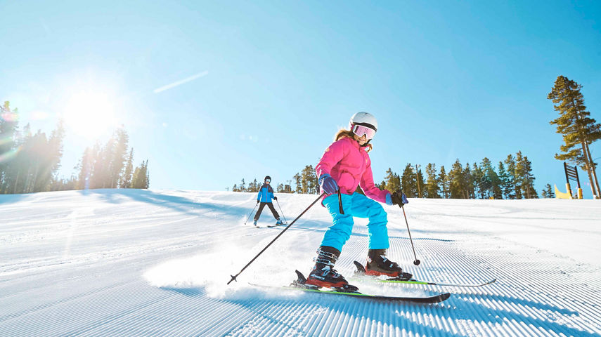 Family enjoys groomed run Schoolmarm at Keystone, CO.