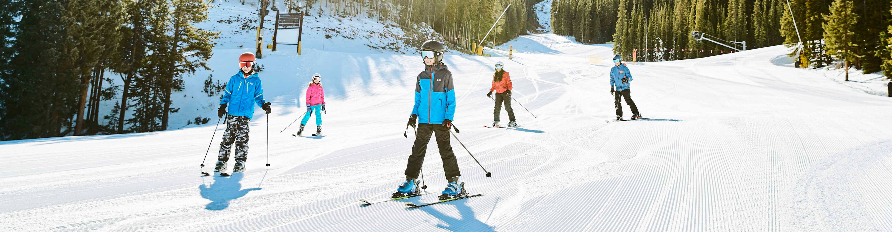 Family enjoys groomed run Schoolmarm at Keystone, CO.