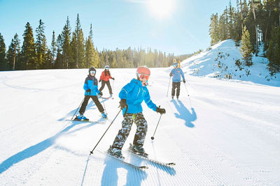 Family enjoys groomed run Schoolmarm at Keystone, CO.