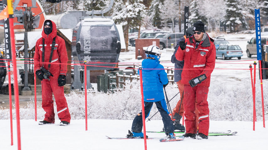 Grey skies with snow falling in Keystone, CO.