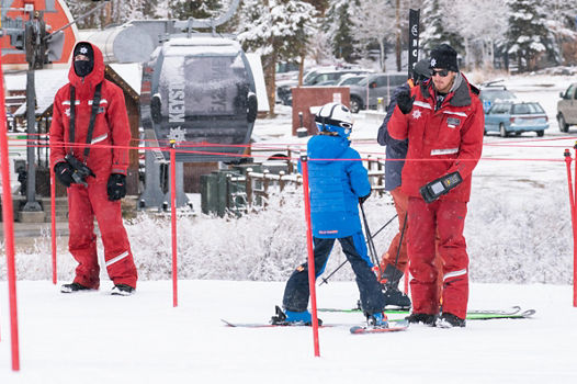 Grey skies with snow falling in Keystone, CO.