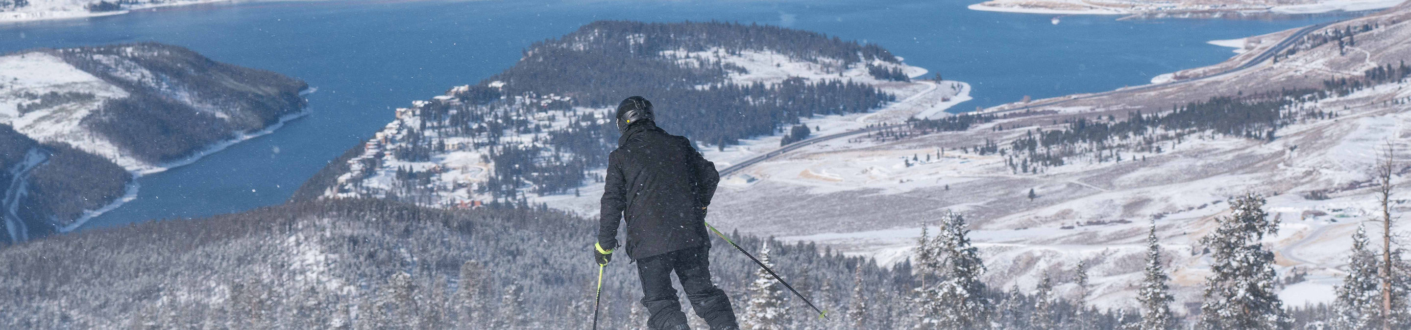 Scenic views with blue skies and Lake Dillon in the background after fresh snowfall in Keystone, CO.