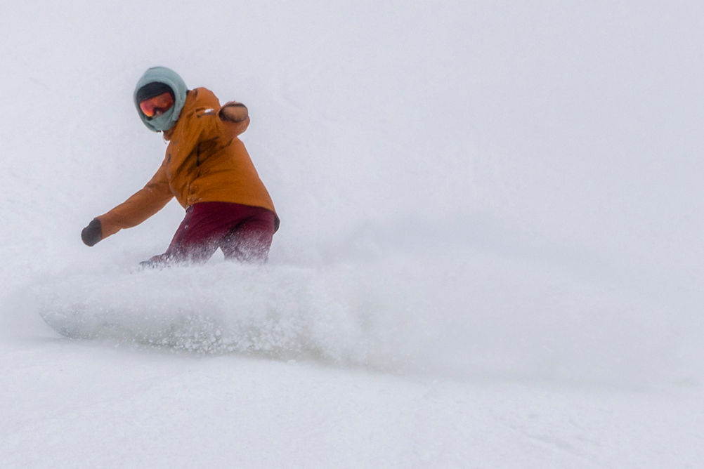 Snowboarder Enjoys Fresh Powder at Mount Snow