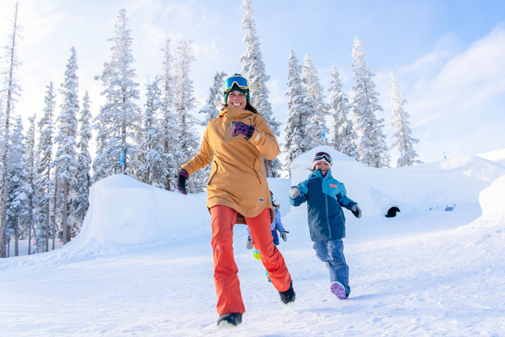 Family plays in the Kidtopia snow fort at Keystone, CO.