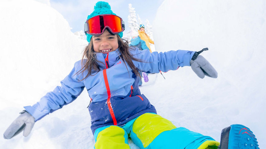 Family plays in the Kidtopia snow fort at Keystone, CO.