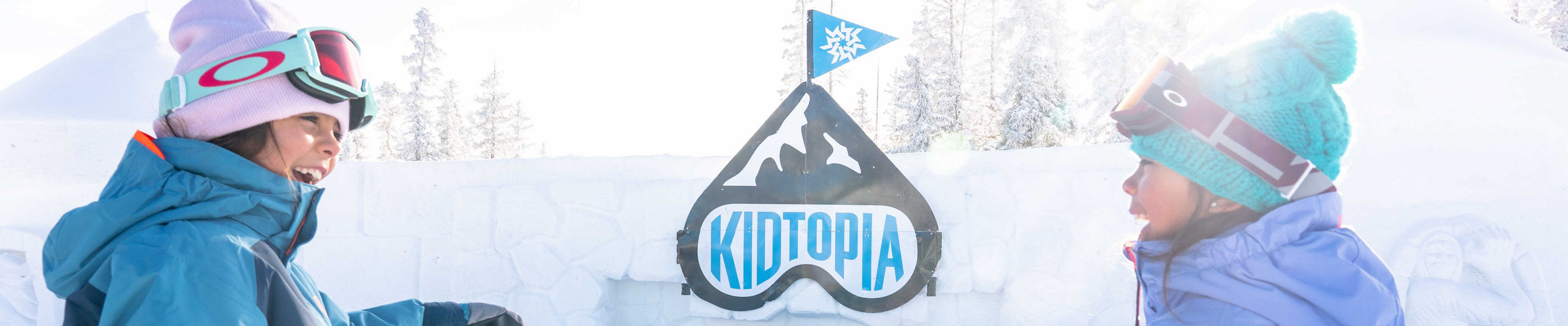 Family plays in the Kidtopia snow fort at Keystone, CO.