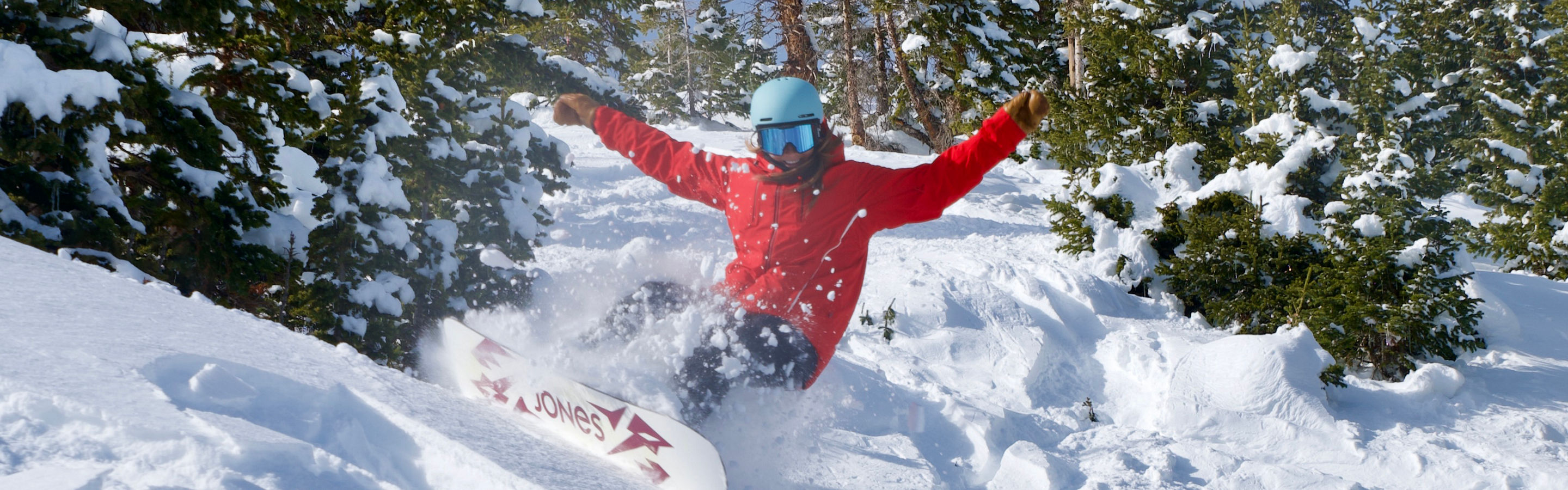 Snowboarder slashing powder in Horseshoe bowl at Breckenridge