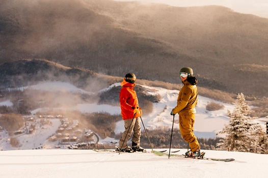 Skiers stop to look at view at Stowe