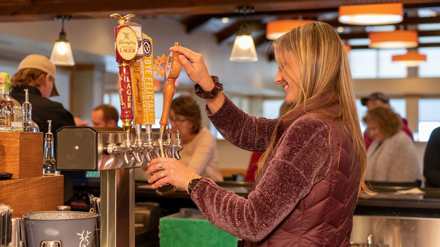 Bartender Pours Draft Beer at Bar at Whitetail