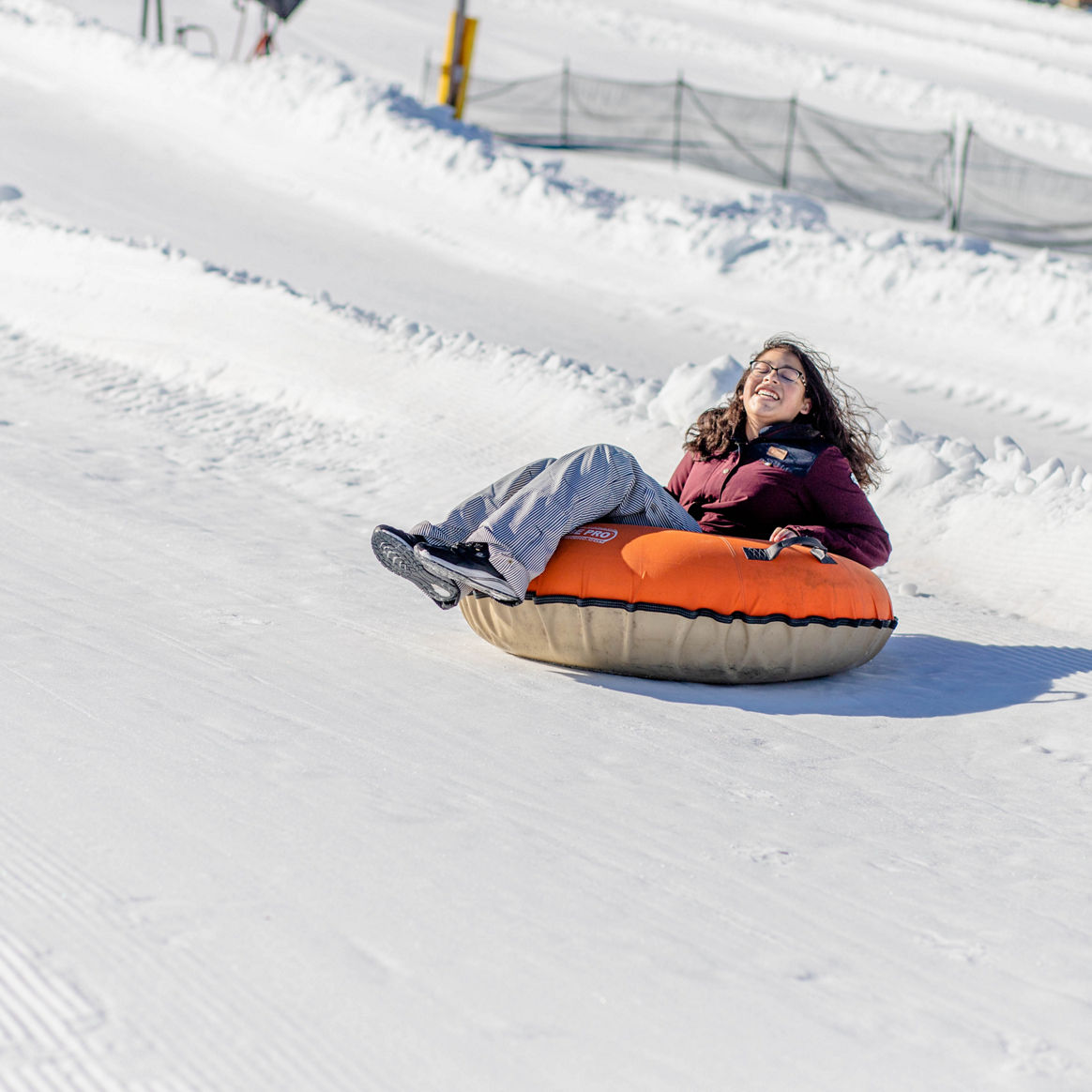 Girl Tubes Downhill at Hunter Mountain