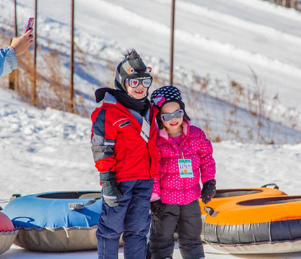 Kids Get Picture Taken on Tubing Hill at Hunter Mountain
