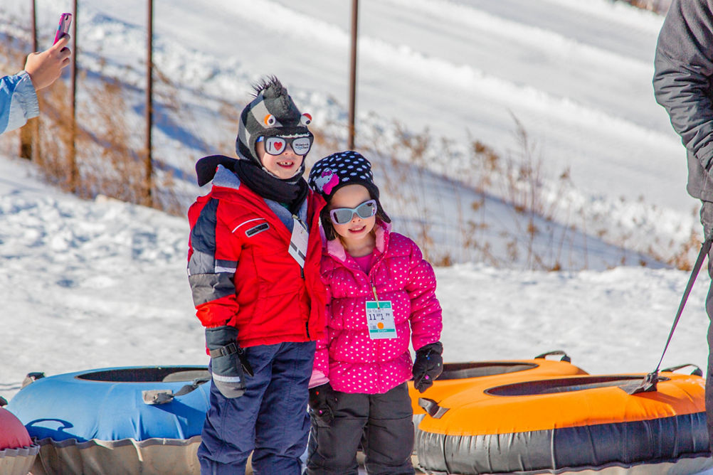 Kids Get Picture Taken on Tubing Hill at Hunter Mountain