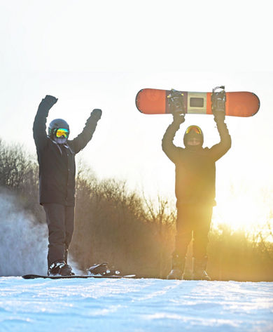 Two Snowboarders Pose on Ski Run at Mad River Mountain
