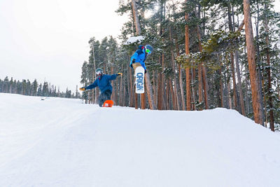 Father and son ride Easy Street in A51 terrain park in Keystone, CO.