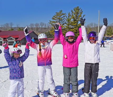 Four Little Girls Pose at Base Area at Mad River Mountain