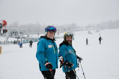 Two Ski Instructors Pose at Liberty Mountain
