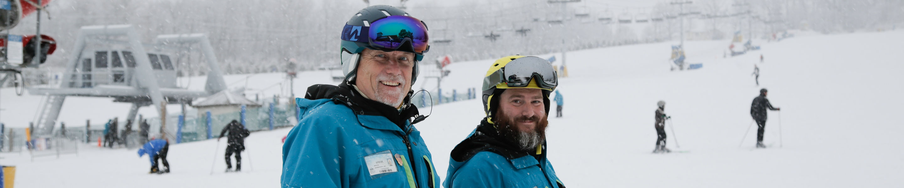 Two Ski Instructors Pose at Liberty Mountain