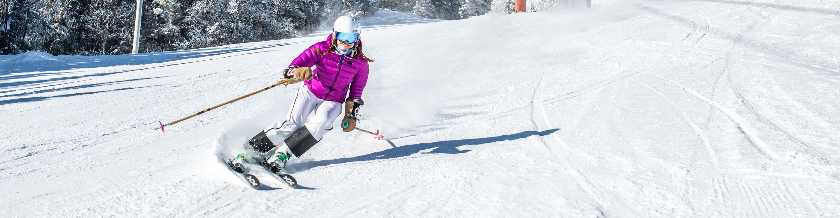 Woman Skis Downhill at Stowe Mountain Resort