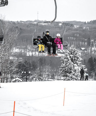 Family Rides Charlift at Alpine Valley
