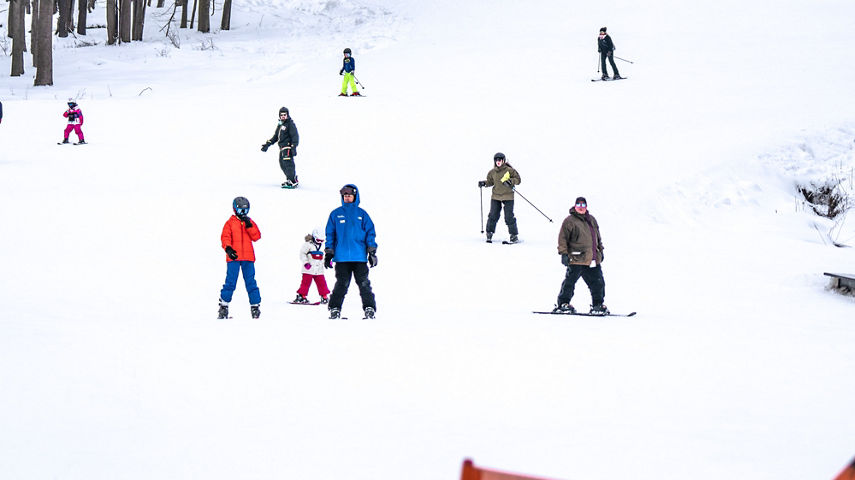 Skiers Ski Downhill at Alpine Valley