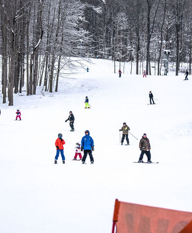 Skiers Ski Downhill at Alpine Valley