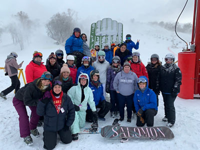Group of Skiers and Riders Pose at Snow Creek