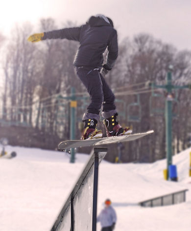 Snowboarder Hits Rail at Mad River Mountain