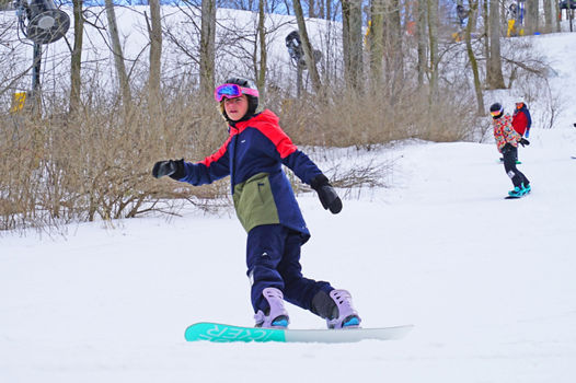 Snowboarder Rides Downhill at Mad River Mountain