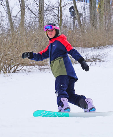 Snowboarder Rides Downhill at Mad River Mountain