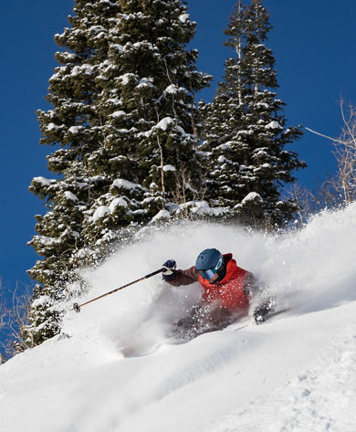 A skier in deep snow at Park City