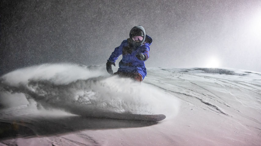 Snowboarder shreds at night on Crotched Mountain