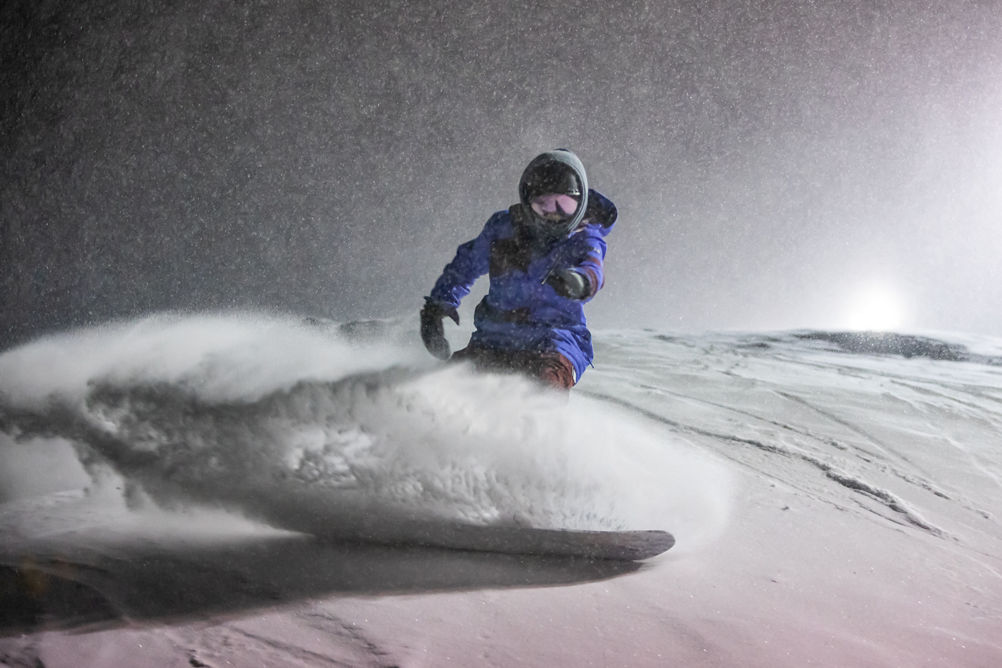Snowboarder shreds at night on Crotched Mountain