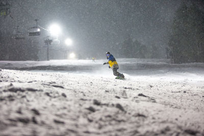 Snowboarder at Night on Crotched Mountain
